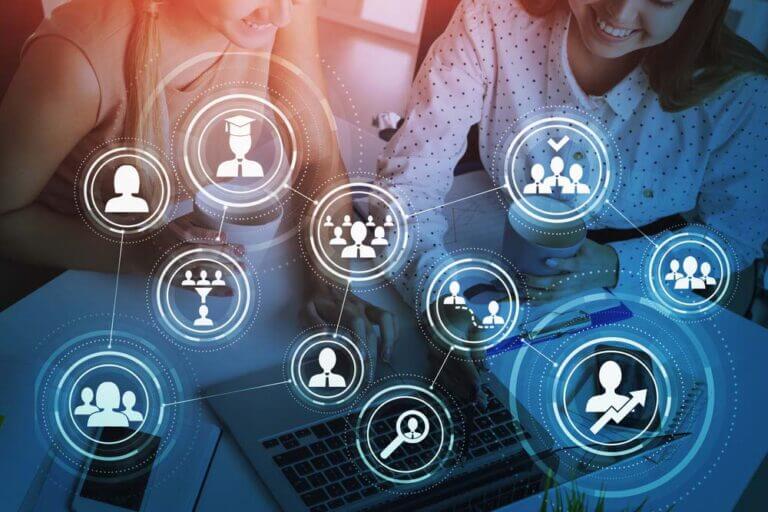 Top,View,Two,Colleagues,Working,Together,To,Find,New,Employees