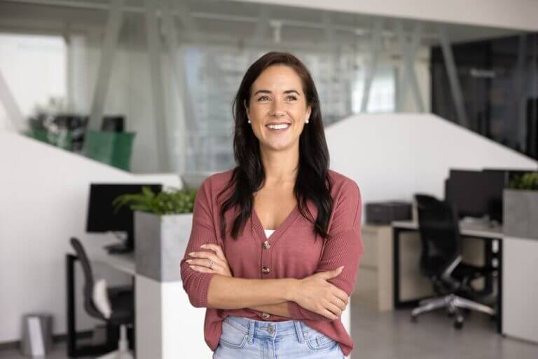 Portrait,Of,Happy,Woman,Posing,With,Arms-crossed,In,Contemporary,Co-working