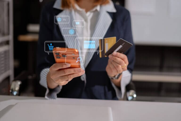 Businessman,Hand,Holding,Credit,Card,And,Use,Laptop,And,Smartphone